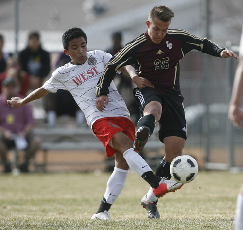 Rick Egan  | The Salt Lake Tribune 

#4 West goes after the ball along with Jadon Cutler (35) Lone Peak,in prep soccer action Lone Peak vs. West, at West High, Monday, March 11, 2013.