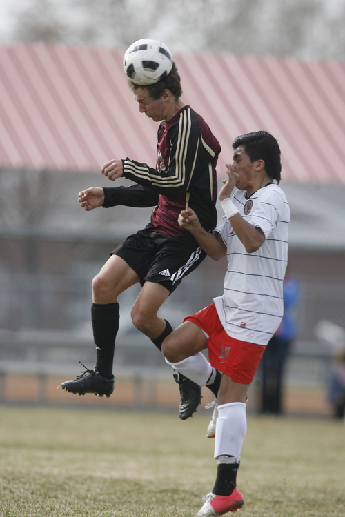 Rick Egan  | The Salt Lake Tribune 

Ryan Morrin (19) collides with #4 West High, in prep soccer action Lone Peak vs. West, at West High, Monday, March 11, 2013.