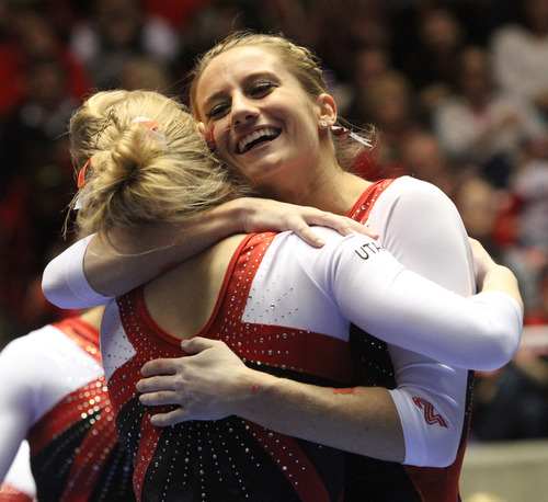 Rick Egan  | The Salt Lake Tribune 

Lia Del Priore (left) congratulates Georgia Dabritz after her performance on the vault for the Ute's, in gymnastics action against The University of California, at the Huntsman Center, Saturday, February 9, 2013. Wilson was awarded a 10.0 for her vault.