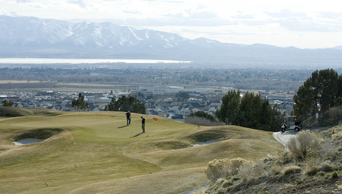Paul Fraughton  |   Salt Lake Tribune
Golfers finish a round of golf on the 18th green at the Cedar Hills Golf  Club in Cedar Hills.
 Tuesday, March 12, 2013