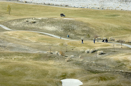 Paul Fraughton  |   Salt Lake Tribune
Golfers tee off on a hole at the Cedar Hills Golf  Club in Cedar Hills
 Tuesday, March 12, 2013