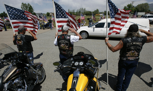 Francisco Kjolseth | The Salt Lake Tribune

The Patriot Riders salute the arrival of Michael Pursel's casket at Layton Memorial Park during Pursel's funeral service May 17, 2007. Pursel was killed in action in Iraq.