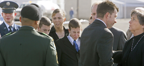 Steve Griffin | The Salt Lake Tribune

Alex Sieger, 14, (center) weeps as he stands with several of his siblings  as they watch the body of their brother, Eric Sieger, 18, being returned home to the Ogden airport Feb. 8, 2007. Eric Sieger was killed while serving in Iraq. Eric's brother James Sieger is far left and mother Krista Sieger is at far right.