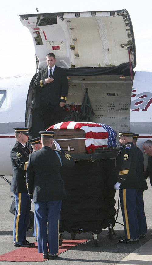 Steve Griffin | The Salt Lake Tribune

The Utah National Guard's State Honor Guard Team receives the body of Eric Sieger, 18, of Layton, at the Ogden airport Feb. 8, 2007. Sieger was killed in the line off duty while serving in Iraq. His body was flown to the Ogden airport by a charter jet.