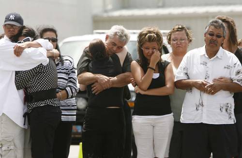 Leah Hogsten | The Salt Lake Tribune

Oliver and Martinez family members, left to right, Tom Michelsen, sister Kim Austin-Oliver, mother Jill Oliver, step-father Daniel Oliver, sisters Jessie and Nikki Martinez, father Virgil Martinez and stepmother Laurie Martinez mourn together as the body of 33-year-old Virgil "Chance" Martinez returned to Utah Sunday May 13, 2007. Army Staff Sgt. Martinez was killed in Iraq May 6, 2007 by a roadside bomb attack. Martinez was assigned to the 1st Battalion, 7th Field Artillery Regiment, 2nd Brigade Combat Team, 1st Infantry Division in Schweinfurt, Germany.
