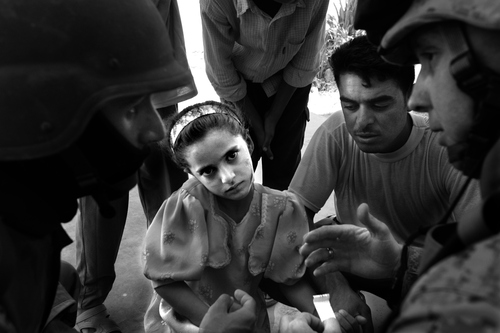 Rick Egan | The Salt Lake Tribune

A young Iraqi girl is treated by American soldiers after being injured during mission to deliver school supplies to a school in a small village near Ramadi, Iraq Tuesday, September 13,  2005.