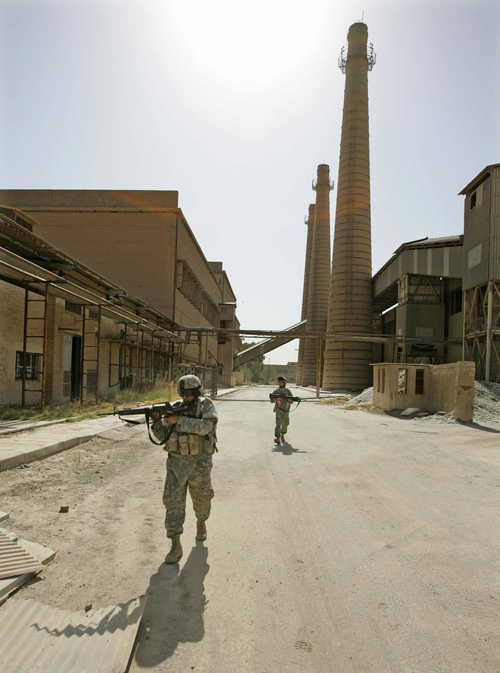 Rick Egan | The Salt Lake Tribune

Soldiers secure the closed Ramadi glass factory in Ramadi, Iraq September 19, 2005.  The factory was closed down by the coalition forces because of sniper fire from the factory.