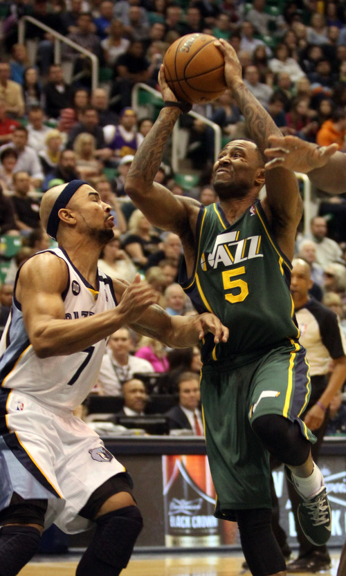 Rick Egan  | The Salt Lake Tribune 

Utah Jazz point guard Mo Williams (5) goes in for a shot, as Memphis Grizzlies point guard Jerryd Bayless (7) defends, in NBA action, The Utah Jazz vs. The Memphis Grizzlies at EnergySolutions Arena, Saturday, March 16, 2013.