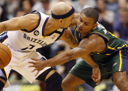 Rick Egan  | The Salt Lake Tribune 

Utah Jazz point guard Earl Watson (11) defends as Memphis Grizzlies point guard Jerryd Bayless (7) holds the ball, in NBA action, The Utah Jazz vs. The Memphis Grizzlies at EnergySolutions Arena, Saturday, March 16, 2013.