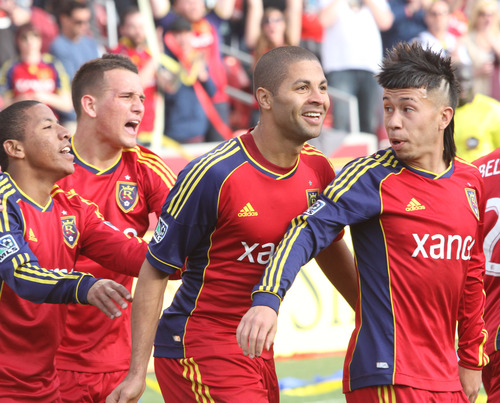 Rick Egan  | The Salt Lake Tribune 

Real Salt Lake forward Jou Plata (8),  and midfielder Luis Gil (21) celebrate with forward Alvaro Saboru (15)  and Real Salt Lake midfielder Sebastian Velasquez (26), after Saboru scored the only goal of the day for Real Salt Lake, as they ended in a 1-1 tie with Colorado, in MLS soccer action, at RIo Tinto Stadium, Saturday, March 16, 2013.