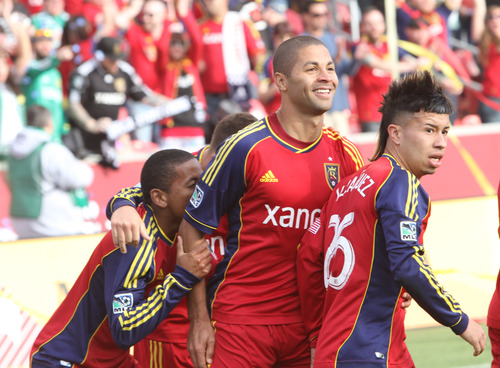 Rick Egan  | The Salt Lake Tribune 

Real Salt Lake forward Jou Plata (8) celebrates with forward Alvaro Saboru (15)  and Real Salt Lake midfielder Sebastian Velasquez (26), after Saboru scored the only goal of the day for Real Salt Lake, as they ended in a 1-1 tie with Colorado, in MLS soccer action, at RIo Tinto Stadium, Saturday, March 16, 2013.