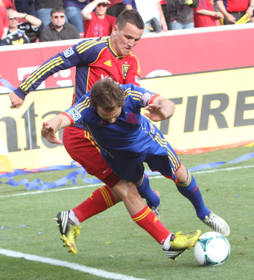 Rick Egan  | The Salt Lake Tribune 

Colorado Rapids midfielder Brian Mullan (11) and Real Salt Lake midfielder Luis Gil (21) battle for possession of the ball, in MLS soccer action, at RIo Tinto Stadium, Saturday, March 16, 2013.