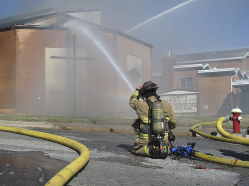 Jessica Miller  |  The Salt Lake Tribune
Fire crews from several Davis County agencies work to fight a blaze sparked Tuesday afternoon in the basement of Clearfield Community Church, 200 S. 500 East, Clearfield.