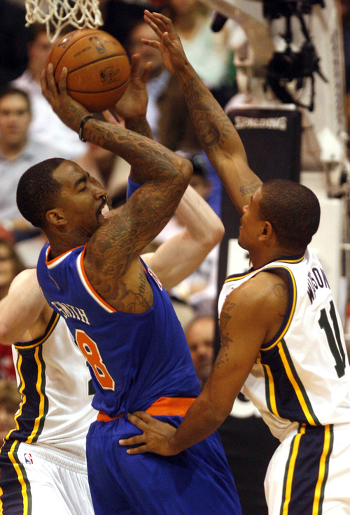 Rick Egan  | The Salt Lake Tribune 

New York Knicks shooting guard J.R. Smith (8) looks for a shot, as Utah Jazz point guard Earl Watson (11) defends in NBA action, Utah Jazz vs. The New York Knick's, at Energy Solutions Arena, Monday, March 18, 2013.