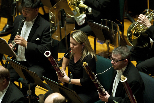 Photo by Chris Detrick | The Salt Lake Tribune 
Members of the Utah Symphony perform Charles Ives' "Three Places in New England," at Abravanel Hall Friday May 27, 2011. Left to right: Tad Calcara, Lori Wike and Luke Pfeil.