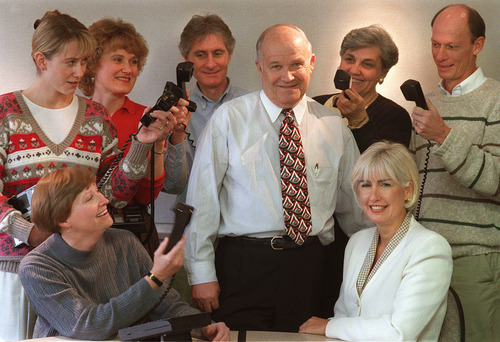 Leah Hogsten | Tribune file photo
"You should see my phone bill," says Utah's premier pollster Dan Jones (center) with wife, Pat, (seated right) and his staff at his offices at Trolley Corners in 1998.