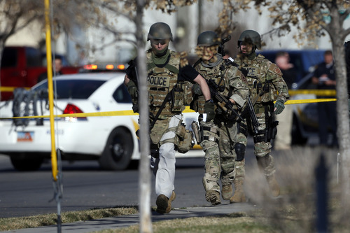 Chris Detrick  |  The Salt Lake Tribune
Law enforcement officers near the scene of a shooting at 1159 S. Foulger Street Tuesday March 19, 2013.