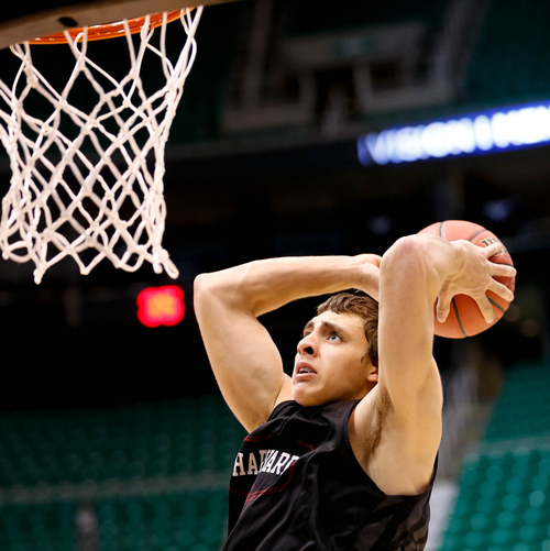 Trent Nelson  |  The Salt Lake Tribune
Harvard's Jonah Travis (24) dunks the ball as Harvard practices the day before their second round matchup with New Mexico in the NCAA Men's Basketball tournament, Wednesday March 20, 2013 in Salt Lake City.