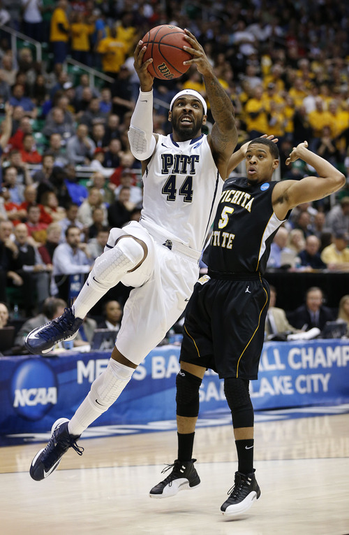 Trent Nelson  |  The Salt Lake Tribune

Pittsburgh Panthers forward J.J. Moore (44) drives past Wichita State Shockers guard Demetric Williams (5) as the Panthers face the Shockers in the NCAA tournament at EnergySolutions Arena on Thursday, March 21, 2013.