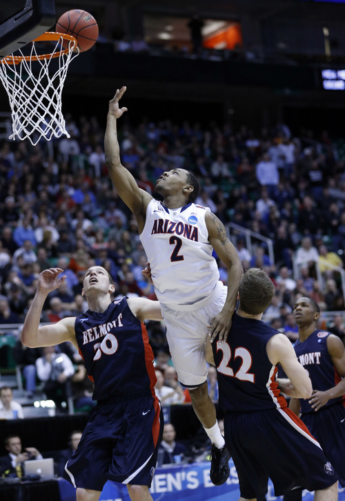 Chris Detrick  |  The Salt Lake Tribune

Arizona Wildcats guard Mark Lyons (2) shoots over Belmont Bruins forward Trevor Noack (30) and guard Reece Chamberlain (22) as the Wildcats face the Bruins in the NCAA tournament at EnergySolutions Arena on Thursday, March 21, 2013.