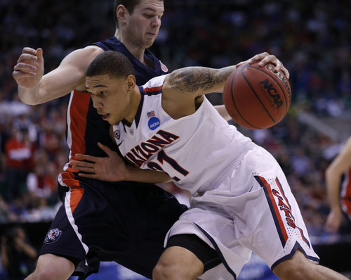 Chris Detrick  |  The Salt Lake Tribune

Arizona Wildcats forward Brandon Ashley (21) drives past Belmont Bruins forward Trevor Noack (30) as the Wildcats face the Bruins in the NCAA tournament at EnergySolutions Arena on Thursday, March 21, 2013.