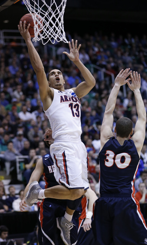 Chris Detrick  |  The Salt Lake Tribune

Arizona Wildcats guard Nick Johnson (13) drives to the hoop past Belmont Bruins forward Trevor Noack (30) as the Wildcats face the Bruins in the NCAA tournament at EnergySolutions Arena on Thursday, March 21, 2013.
