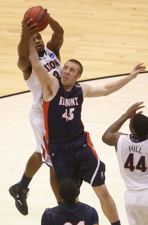 Trent Nelson  |  The Salt Lake Tribune

Arizona Wildcats guard/forward Kevin Parrom (3) and Belmont Bruins forward Brandon Baker (45) fight for the ball as the Wildcats face the Bruins in the NCAA tournament at EnergySolutions Arena on Thursday, March 21, 2013.
