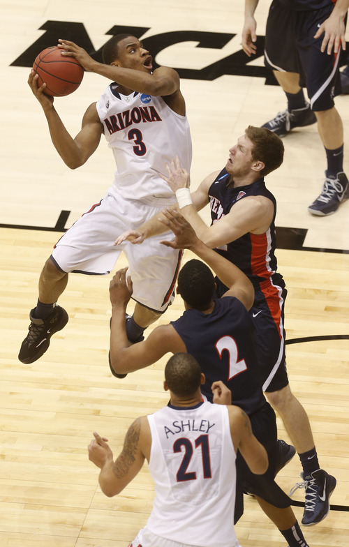 Trent Nelson  |  The Salt Lake Tribune

Arizona Wildcats guard/forward Kevin Parrom (3) shoots over Belmont Bruins guard Reece Chamberlain (22) and forward Blake Jenkins (2) as the Wildcats face the Bruins in the NCAA tournament at EnergySolutions Arena on Thursday, March 21, 2013.