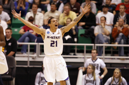 Rick Egan | The Salt Lake Tribune

Kansas State's Denis Clemente (21) celebrates after his team beat Xavier in double overtime during the West Regional of the NCAA Tournament at EnergySolutions Arena, Thursday, March 25, 2010.