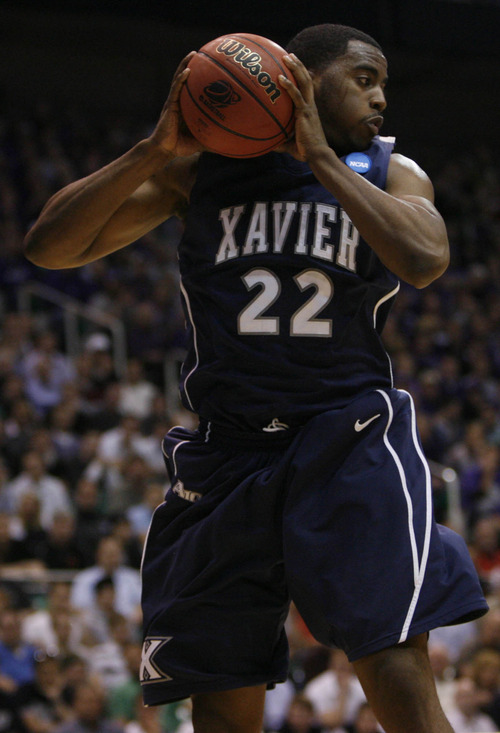 Trent Nelson | The Salt Lake Tribune

Xavier's Jamel McLean (22) pulls down a rebound as Xavier faces Kansas State during the West Regional of the NCAA Tournament at EnergySolutions Arena, Thursday, March 25, 2010.