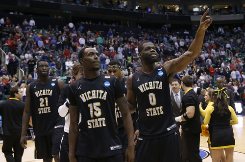 Chris Detrick  |  The Salt Lake Tribune

Wichita State Shockers guard Nick Wiggins (15) and forward Chadrack Lufile (0) leave the court after beating Pittsburgh in the NCAA tournament at EnergySolutions Arena on Thursday, March 21, 2013.