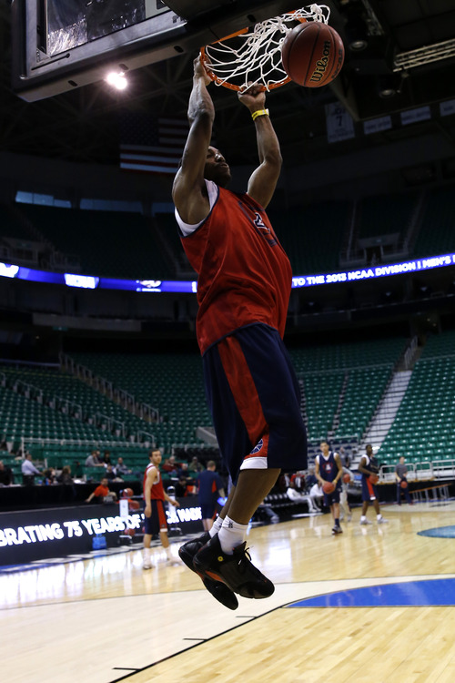 Chris Detrick  |  The Salt Lake Tribune
Arizona Wildcats guard Mark Lyons (2) dunks the ball during a practice at EnergySolutions Arena Wednesday March 20, 2013.