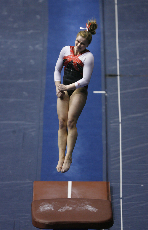 Scott Sommerdorf   |  The Salt Lake Tribune
Utah's Tory Wilson hits a 9.950 performance on the vault. She won individual titles in vault, beam and all-around as The Utah Red Rocks won a tri meet versus BYU and North Carolina State at BYU, Friday, March 1, 2013. Utah finished with 197.125 points to BYU's 195.000, and N.C.St. with 194.675.