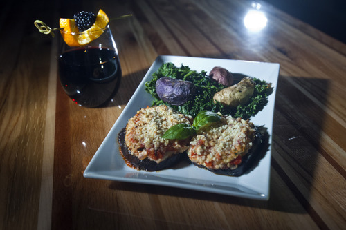 Chris Detrick  |  The Salt Lake Tribune
Eggplant parmesan with cashew cheese, roasted fingerling potatoes and kale ($13) served with beet sangria – organic red wine with organic beet juice and fresh fruit ($7) at Zest Kitchen & Bar in Salt Lake City.