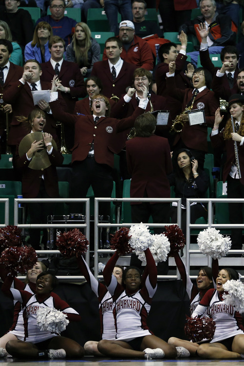 Chris Detrick  |  The Salt Lake Tribune
Members of the Harvard Crimson band and cheerleaders cheer during the NCAA tournament at EnergySolutions Arena Thursday March 21, 2013.  Harvard won the game 68-62.