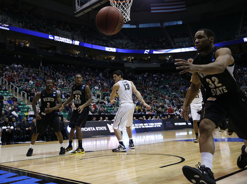 Chris Detrick  |  The Salt Lake Tribune

Wichita State Shockers guard Tekele Cotton (32) saves the ball from going out of bounds as the Panthers face the Shockers in the NCAA tournament at EnergySolutions Arena on Thursday, March 21, 2013.