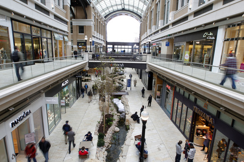 Al Hartmann  |  The Salt Lake Tribune
People shop under cover from the snow outside in City Creek Center Friday March 22.   City Creek Center is celebrating its one-year anniversary today and Saturday with sales, promotions and live music.