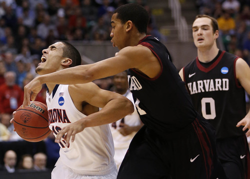 Trent Nelson  |  The Salt Lake Tribune

Arizona Wildcats guard Nick Johnson (13) is fouled by Harvard Crimson guard Siyani Chambers (1) as the Wildcats face the Crimson in the NCAA tournament at EnergySolutions Arena on Saturday, March 23, 2013.