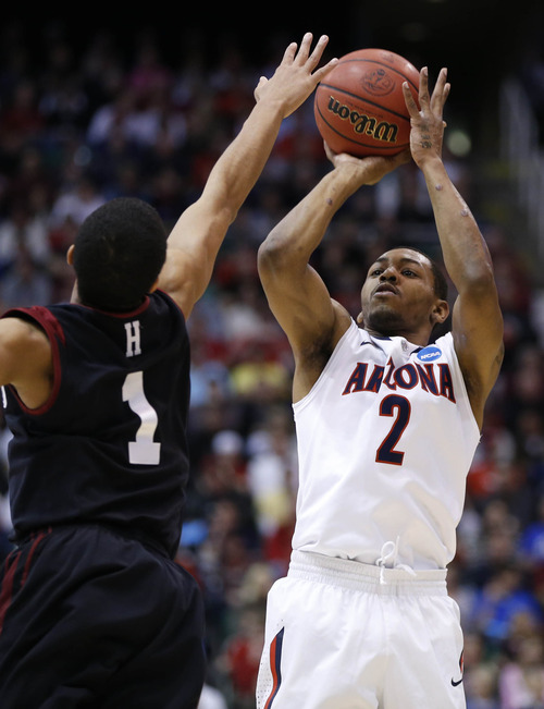Trent Nelson  |  The Salt Lake Tribune

Arizona Wildcats guard Mark Lyons (2) gets a shot off over Harvard Crimson guard Siyani Chambers (1) as the Wildcats face the Crimson in the NCAA tournament at EnergySolutions Arena on Saturday, March 23, 2013.
