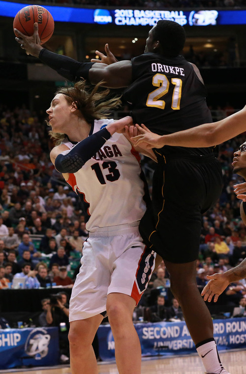 Scott Sommerdorf  |  The Salt Lake Tribune

Wichita State Shockers center Ehimen Orukpe (21) shoots over Gonzaga Bulldogs forward Kelly Olynyk (13) as the Bulldogs face the Shockers in the NCAA tournament at EnergySolutions Arena on Saturday, March 23, 2013.