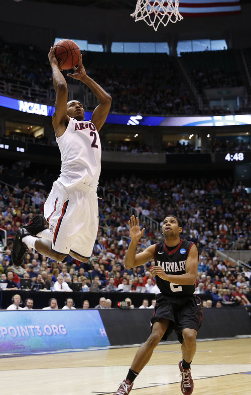 Trent Nelson  |  The Salt Lake Tribune

Arizona Wildcats guard Mark Lyons (2) scores a basket chased by Harvard Crimson guard Alex Nesbitt (2) as the Wildcats face the Crimson in the NCAA tournament at EnergySolutions Arena on Saturday, March 23, 2013.