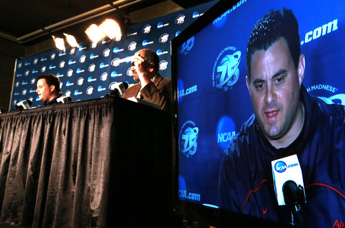 Scott Sommerdorf   |  The Salt Lake Tribune
Arizona head coach Sean Miller seen on a tv monitor as he speaks live at a press conference after their practice session, Friday, March 22, 2013.
