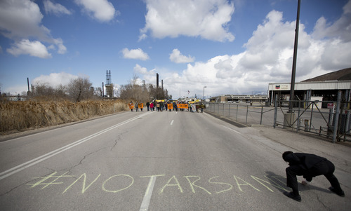 Lennie Mahler  |  The Salt Lake Tribune
Protesters leave the Chevron oil refinery in Salt Lake City, voicing opposition to oil extraction from tar sands, citing damage to the environment, wildlife, and public health. Saturday, March 23, 2013.