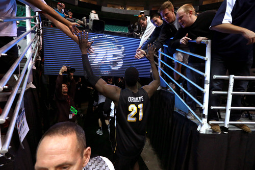 Scott Sommerdorf  |  The Salt Lake Tribune

Wichita State Shockers center Ehimen Orukpe (21) is congratulated by fans after beating Gonzaga in the NCAA tournament at EnergySolutions Arena on Saturday, March 23, 2013.