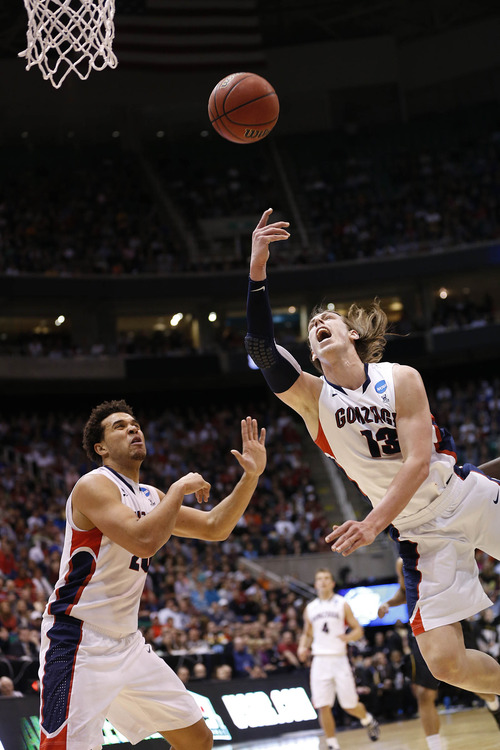 Trent Nelson  |  The Salt Lake Tribune

Gonzaga Bulldogs forward Kelly Olynyk (13) shoots the ball next to teammate Gonzaga Bulldogs forward Elias Harris (20) as the Bulldogs face the Shockers in the NCAA tournament at EnergySolutions Arena on Saturday, March 23, 2013.