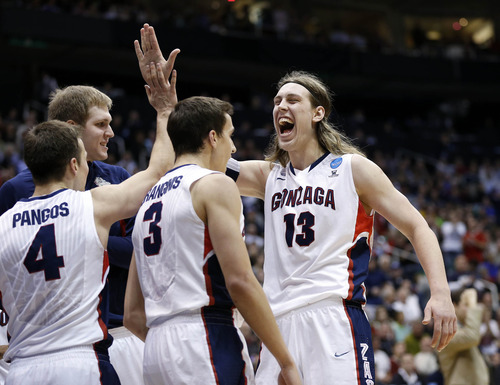 Trent Nelson  |  The Salt Lake Tribune

Gonzaga Bulldogs forward Kelly Olynyk (13) celebrates with teammates as the Bulldogs face the Shockers in the NCAA tournament at EnergySolutions Arena on Saturday, March 23, 2013.