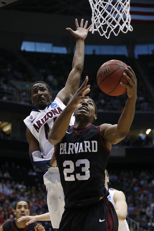 Trent Nelson  |  The Salt Lake Tribune

Harvard Crimson guard/forward Wesley Saunders (23) shoots defended by Arizona Wildcats forward Solomon Hill (44) as the Wildcats face the Crimson in the NCAA tournament at EnergySolutions Arena on Saturday, March 23, 2013.