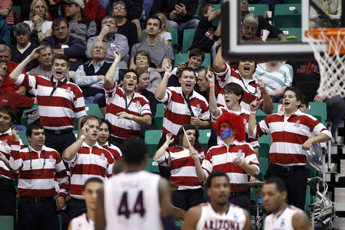 Trent Nelson  |  The Salt Lake Tribune

The Arizona band cheers as the Wildcats face the Crimson in the NCAA tournament at EnergySolutions Arena on Saturday, March 23, 2013.