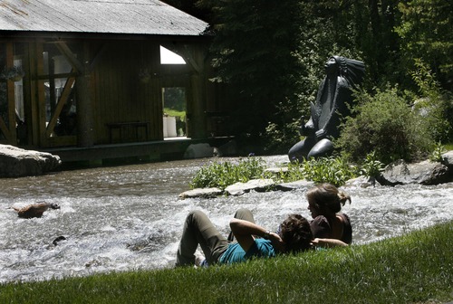 Scott Sommerdorf  |  The Salt Lake Tribune
A young couple relaxes on the grass near a stream running past one of the rehearsal halls at the Sundance Institute Filmmakers Lab, Thursday, June 17, 2011. The Lab, which gives young directors a place to workshop their scripts with real actors and crews, advised by great names in the movie industry, is about to have it's 30th anniversary.