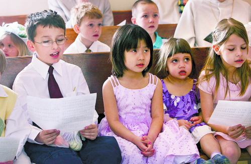 EASTER  --------
Choir practice prior to the Easter celebration at Mount Tabor Lutheran Church, Sunday 3/23/08. From left to right: Eric Jensen (8), Lydia Smith (5), Tanisha Afu (2) and Angel Marshall (8) struggle to keep up with the choir conductor.
----------------------
Mount Tabor Lutheran Church on Easter Sunday. They're having a breakfast that starts at 9 a.m., services start at 10:30 a.m., but before services start there's an Easter egg hunt for kids. 
Salt Lake Tribune photo / Scott Sommerdorf